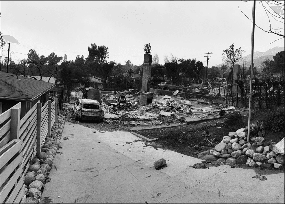 Another view of the devastation caused by the Eaton Fire in Altadena, CA in January 2025. Fire hydrants malfunctioned or ran dry in the first 24 hours. The few homes that managed to survive the flames were often the sole structures standing in entire neighborhoods of smoldering rubble and sustained heavy smoke and soot damage, rendering them uninhabitable.